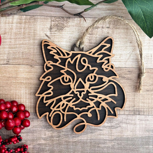 Balinese line art cat ornament laser cut from natural wood, minimalist feline silhouette design
