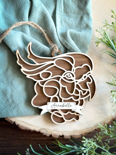 cockatoo line art ornament laser cut from natural wood in continuous line style