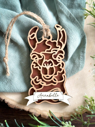 llama line art ornament laser cut from natural wood in continuous line style