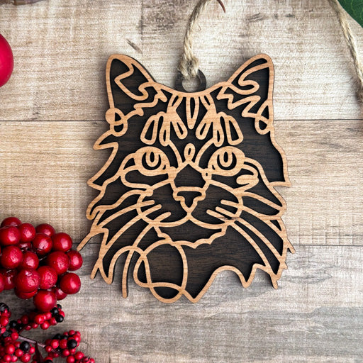Tabby line art cat ornament laser cut from natural wood, minimalist feline silhouette design
