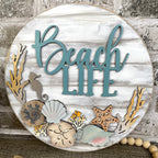 Beach Life Door Hanger with sea shells, coral and sea creatures on a shiplap backer