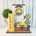 Decorative set with lemon-themed items including a door, basket, and sign on a wooden background.