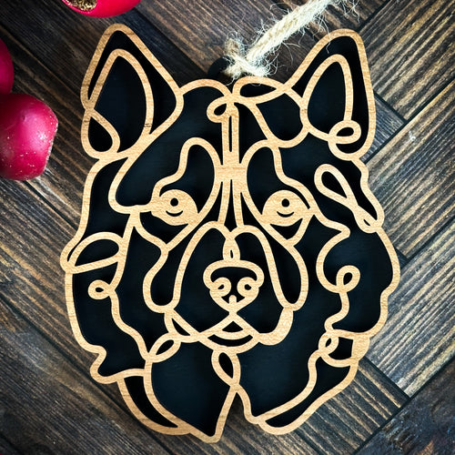 Alaskan Malamute  line art dog ornament laser cut from natural wood.