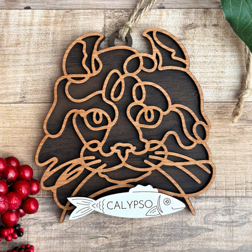 American Curl line art cat ornament laser cut from natural wood, minimalist feline silhouette design