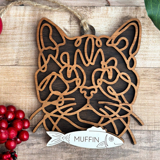 American Shorthair line art cat ornament laser cut from natural wood, minimalist feline silhouette design
