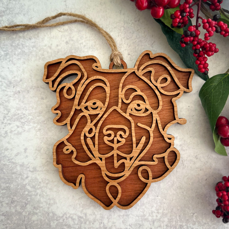 Australian Shepherd  line art dog ornament laser cut from natural wood.