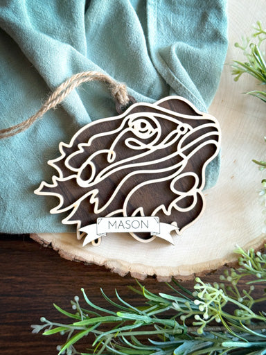 bearded dragon line art ornament laser cut from natural wood in continuous line style