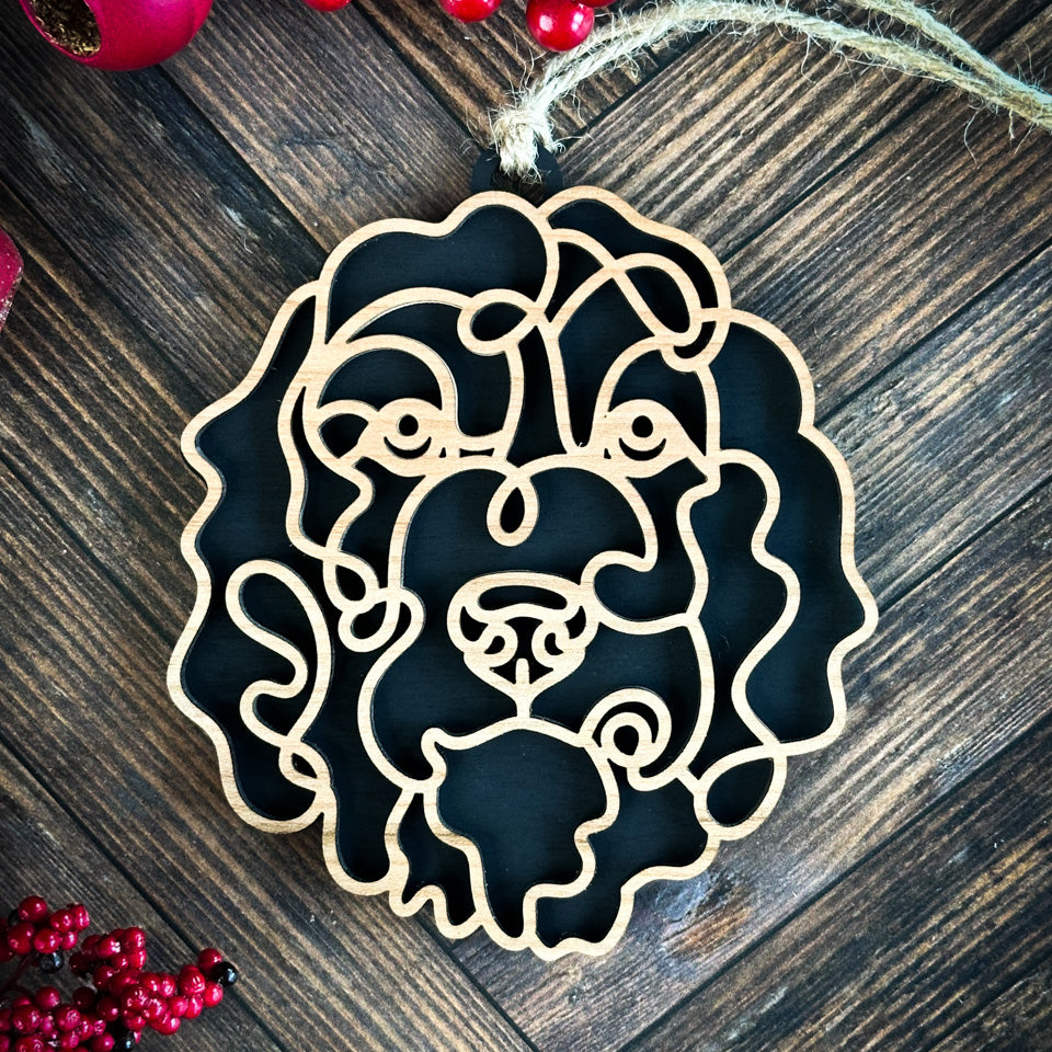 Bernedoodle  line art dog ornament laser cut from natural wood.