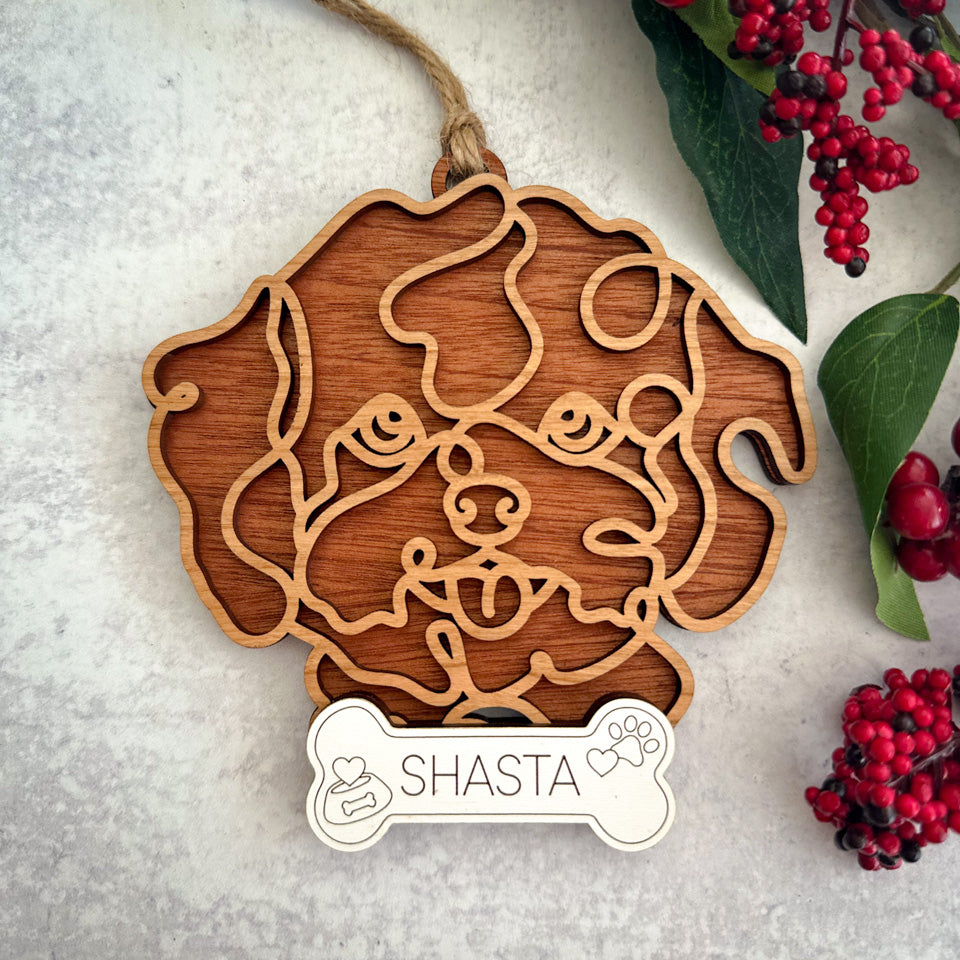 Bichon Frise line art dog ornament laser cut from natural wood.