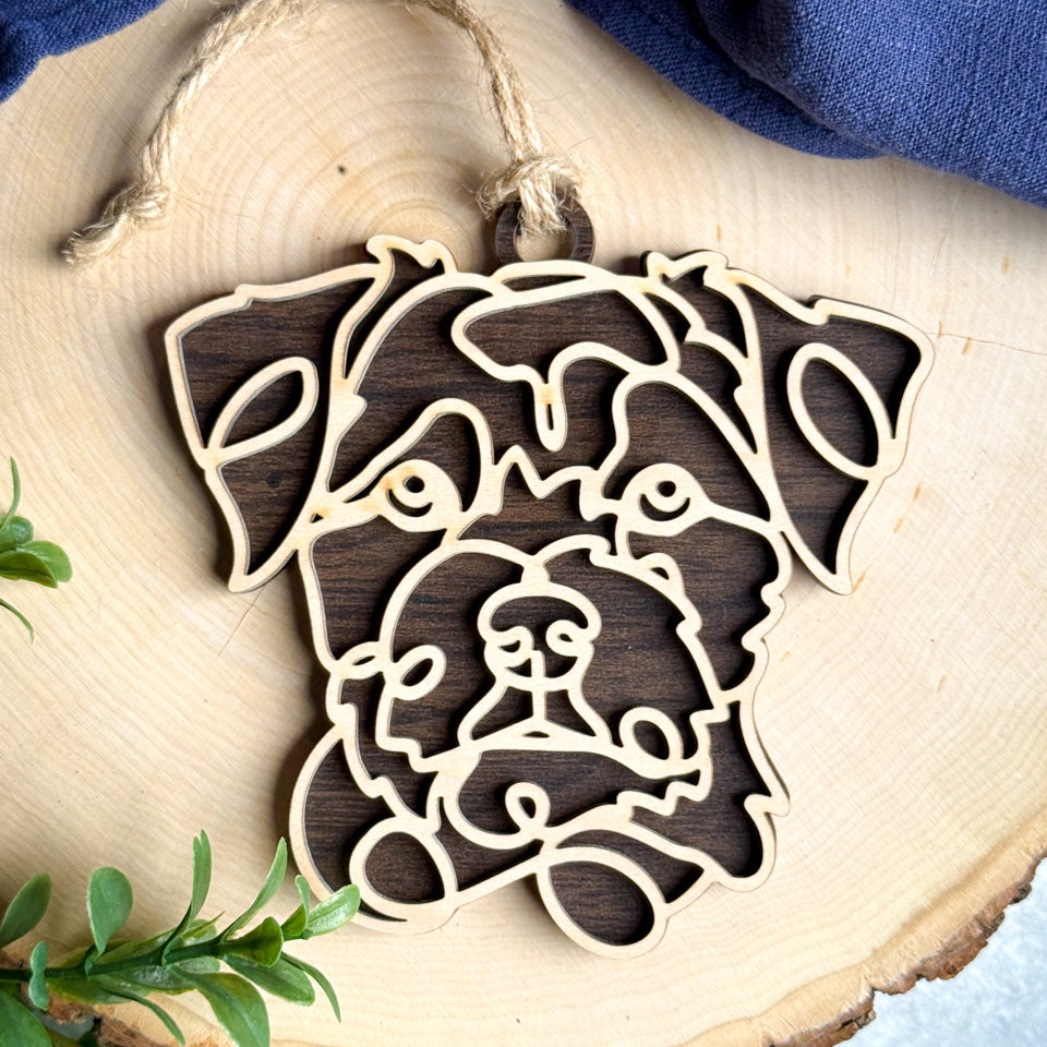 Border Terrier line art dog ornament laser cut from natural wood.