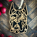Boxer with cropped ears line art dog ornament laser cut from natural wood.