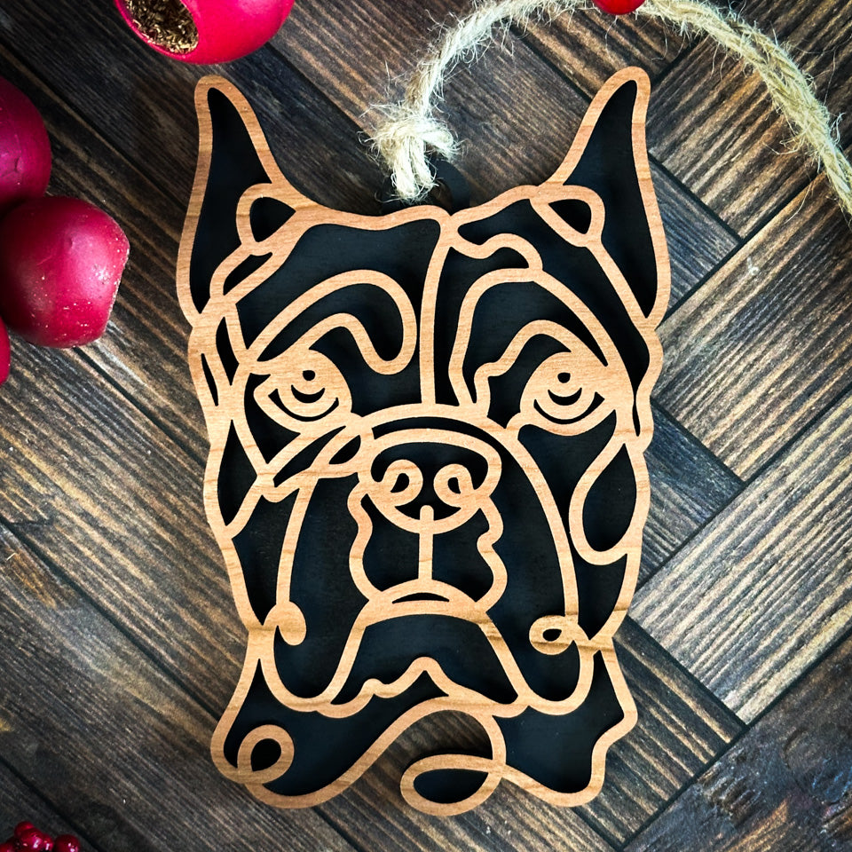 Boxer with cropped ears line art dog ornament laser cut from natural wood.