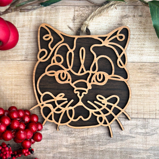 British Shorthair line art cat ornament laser cut from natural wood, minimalist feline silhouette design
