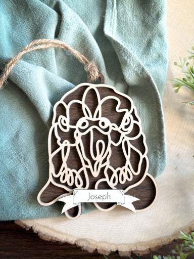 budgie line art ornament laser cut from natural wood in continuous line style