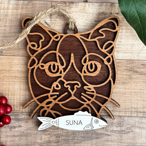 Burmese line art cat ornament laser cut from natural wood, minimalist feline silhouette design