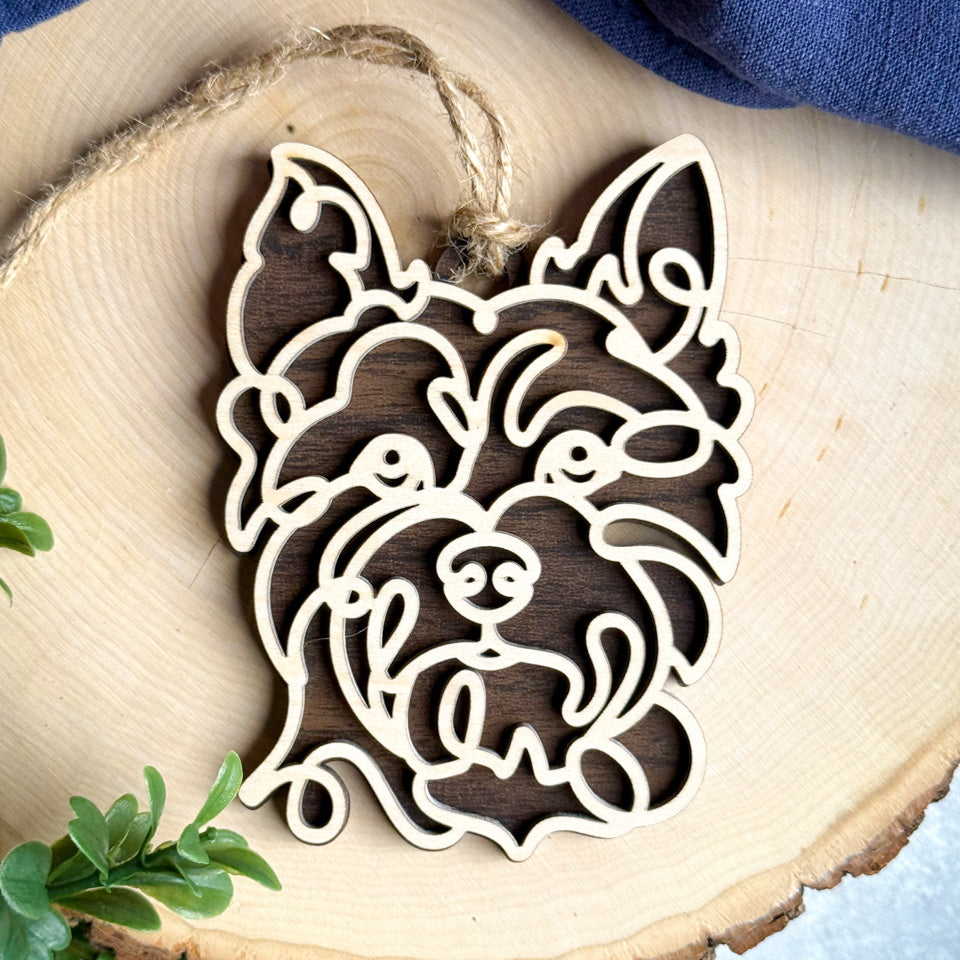 Cairn Terrier line art dog ornament laser cut from natural wood.