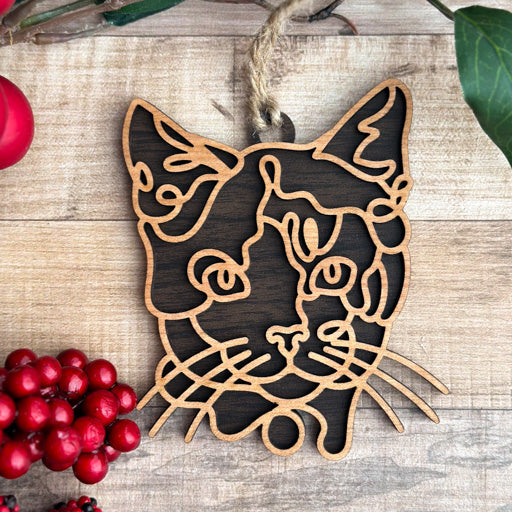 Calico - Short Hair line art cat ornament laser cut from natural wood, minimalist feline silhouette design