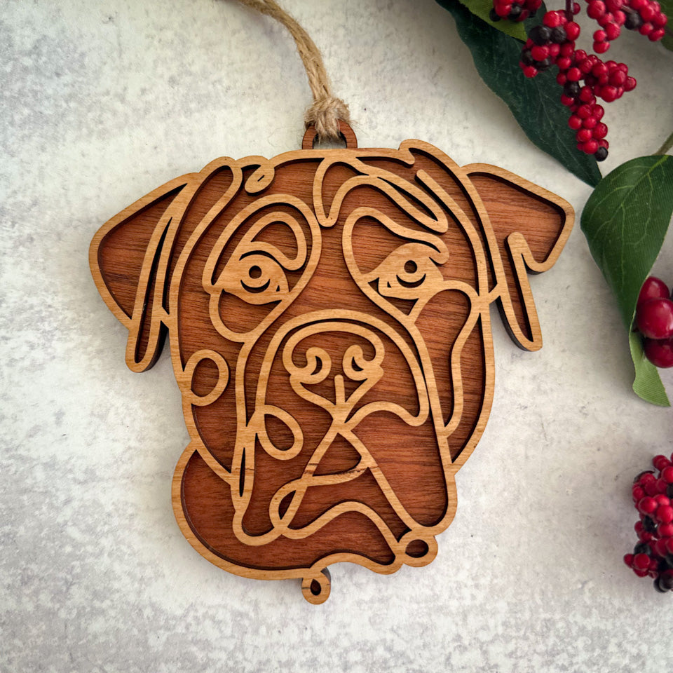Cane Corso line art dog ornament laser cut from natural wood.