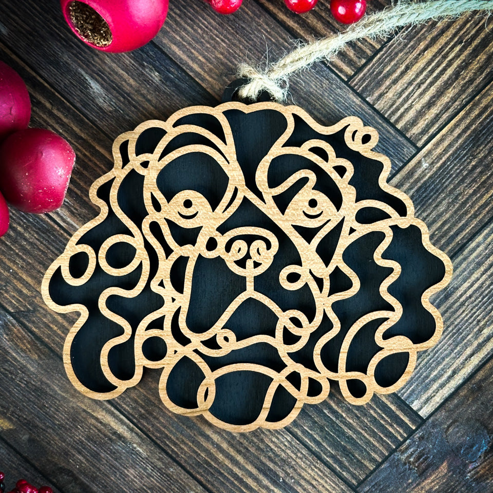 Cavalier King Charles Spaniel line art dog ornament laser cut from natural wood.