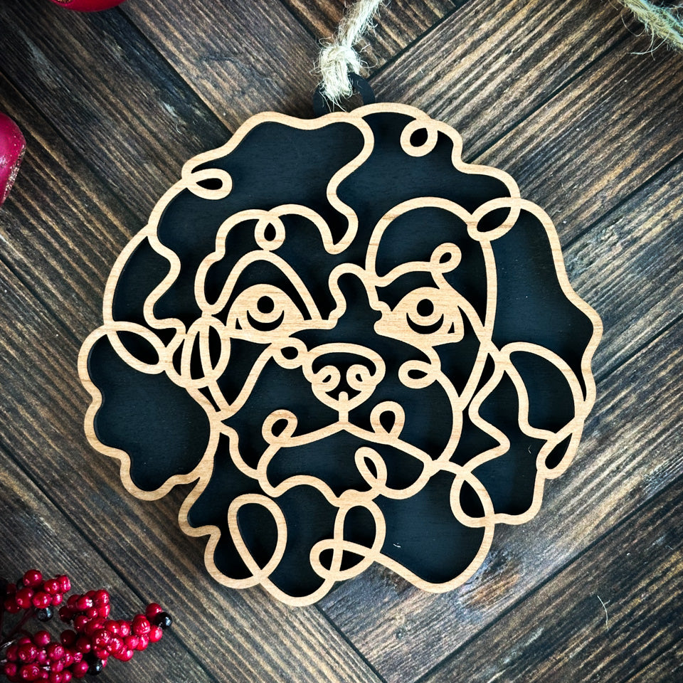 Cavapoo line art dog ornament laser cut from natural wood.