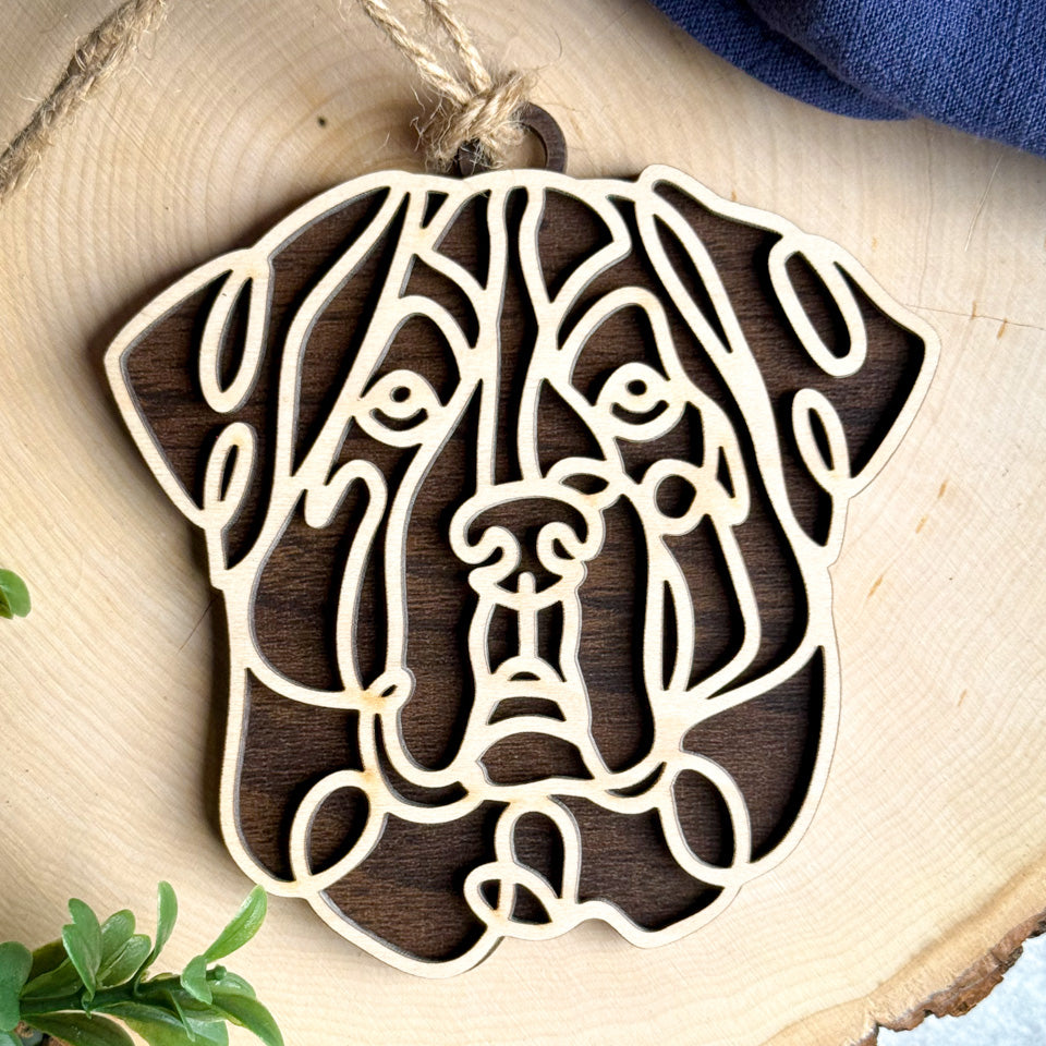 Central Asian Shepherd line art dog ornament laser cut from natural wood.