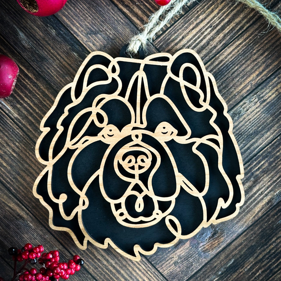 Chow Chow line art dog ornament laser cut from natural wood.