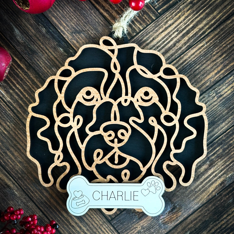 Cockapoo line art dog ornament laser cut from natural wood.