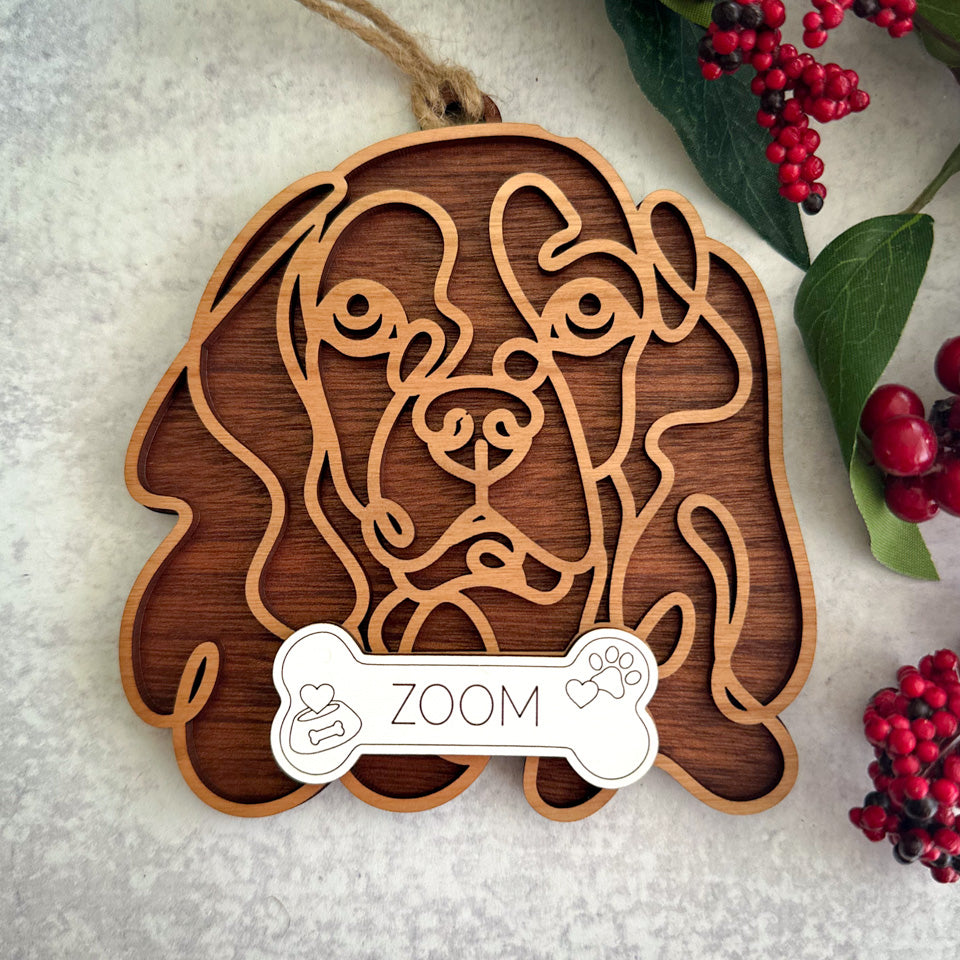 Cocker Spaniel line art dog ornament laser cut from natural wood.