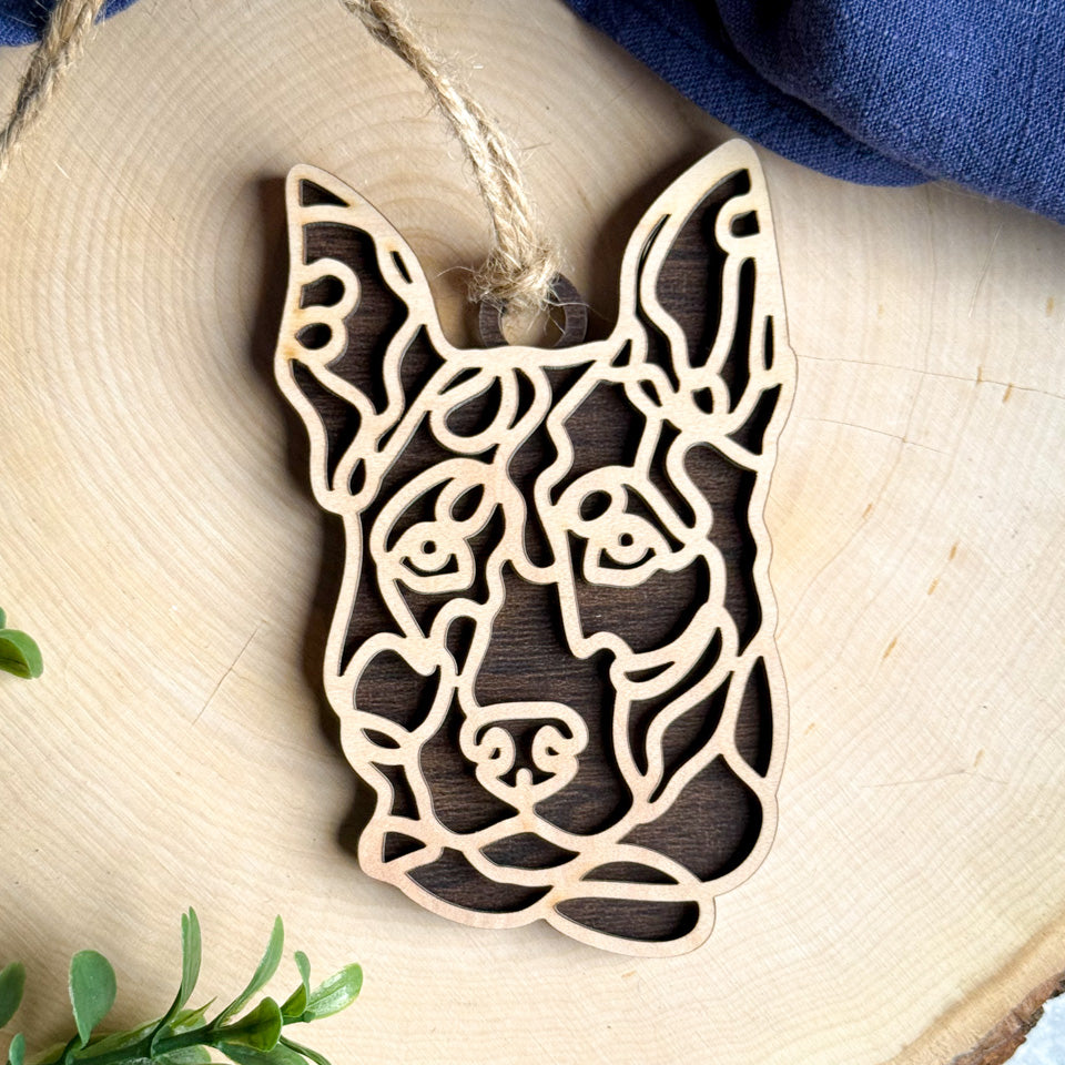 Decker Hunting Terrier line art dog ornament laser cut from natural wood.