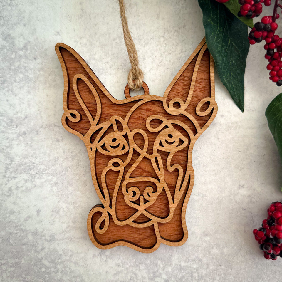 Dobermann line art dog ornament laser cut from natural wood.