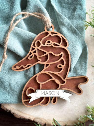 duck line art ornament laser cut from natural wood in continuous line style