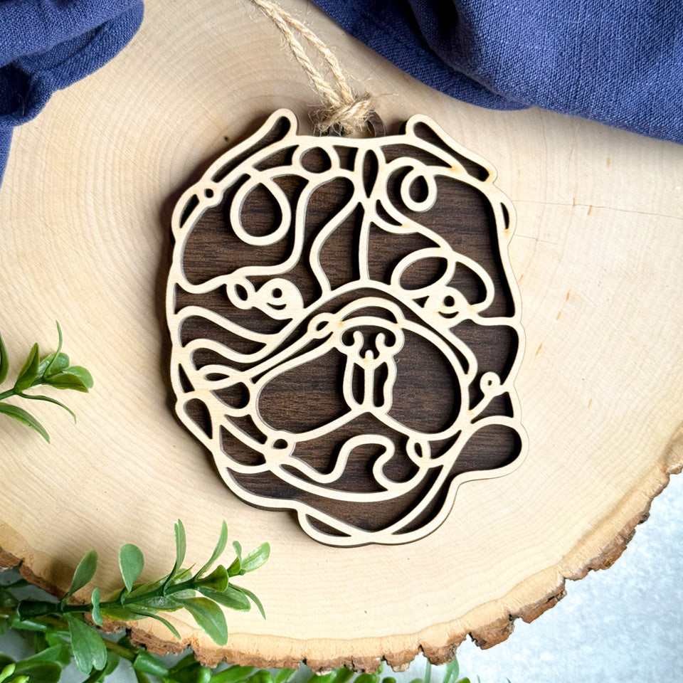 Exotic Bulldog Cropped line art dog ornament laser cut from natural wood.