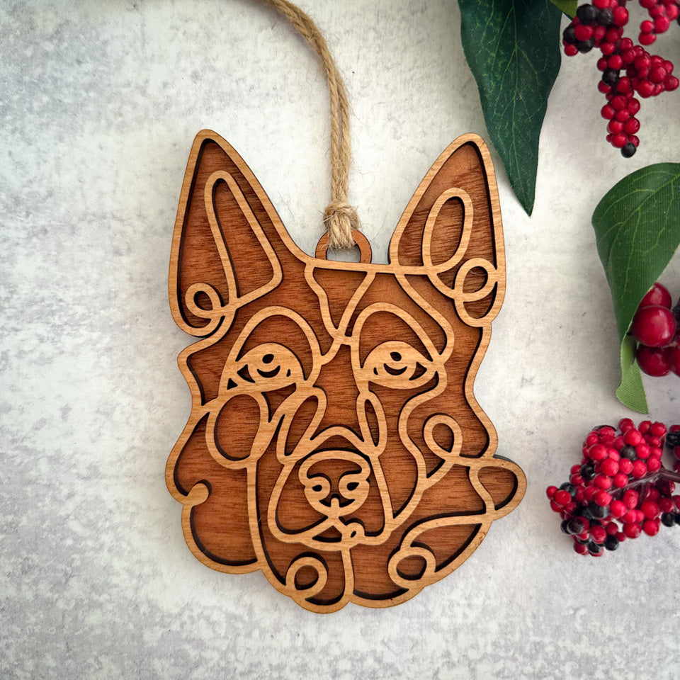 German Shepherd line art dog ornament laser cut from natural wood.