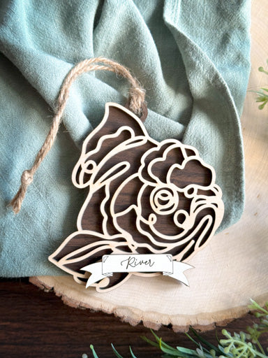 goldfish line art ornament laser cut from natural wood in continuous line style