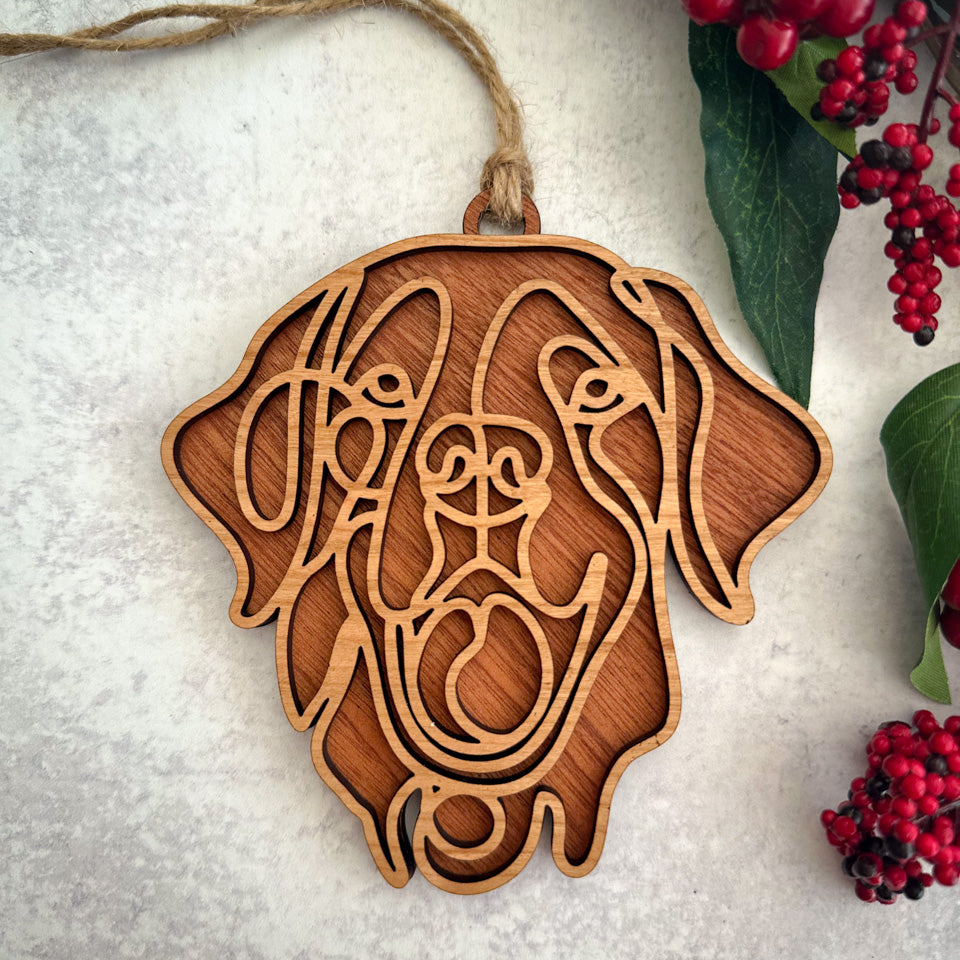 Golden Retriever line art dog ornament laser cut from natural wood.