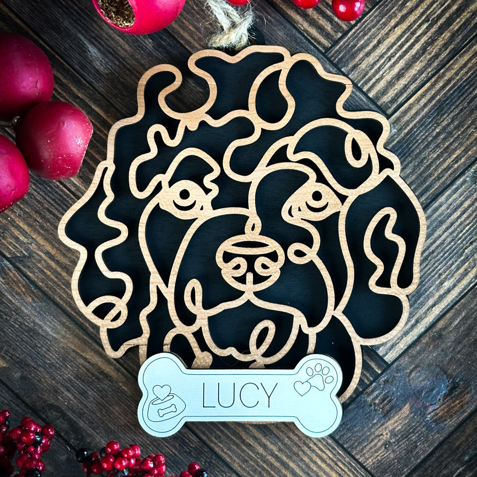 Goldendoodle line art dog ornament laser cut from natural wood.