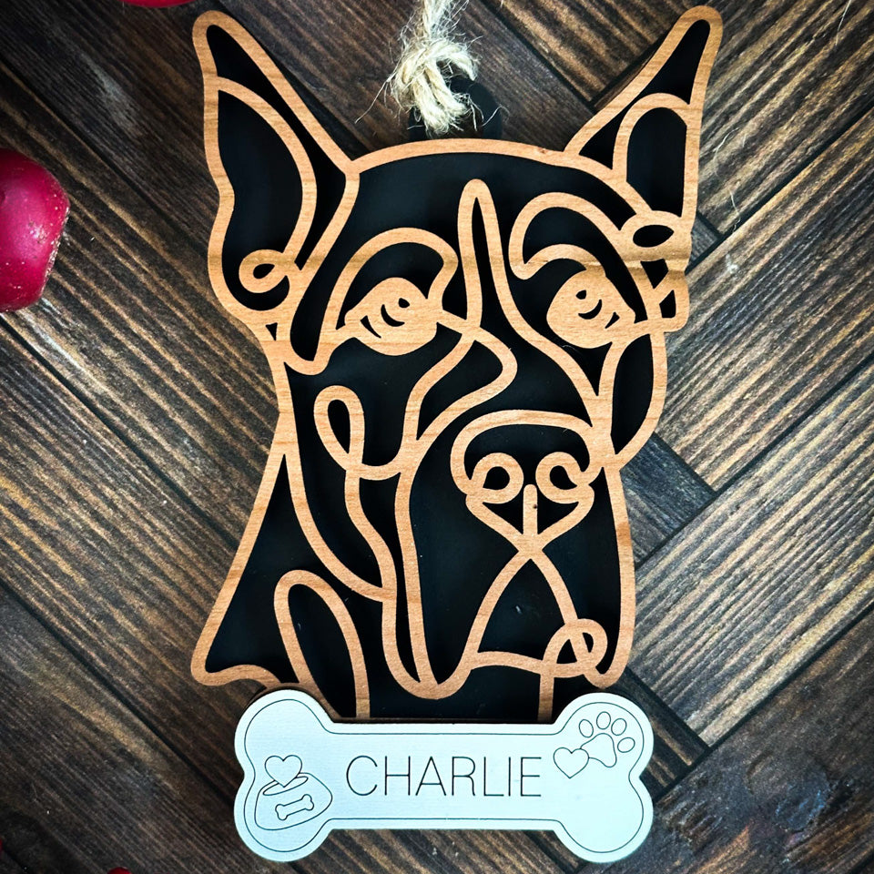 Great Dane Cropped line art dog ornament laser cut from natural wood.