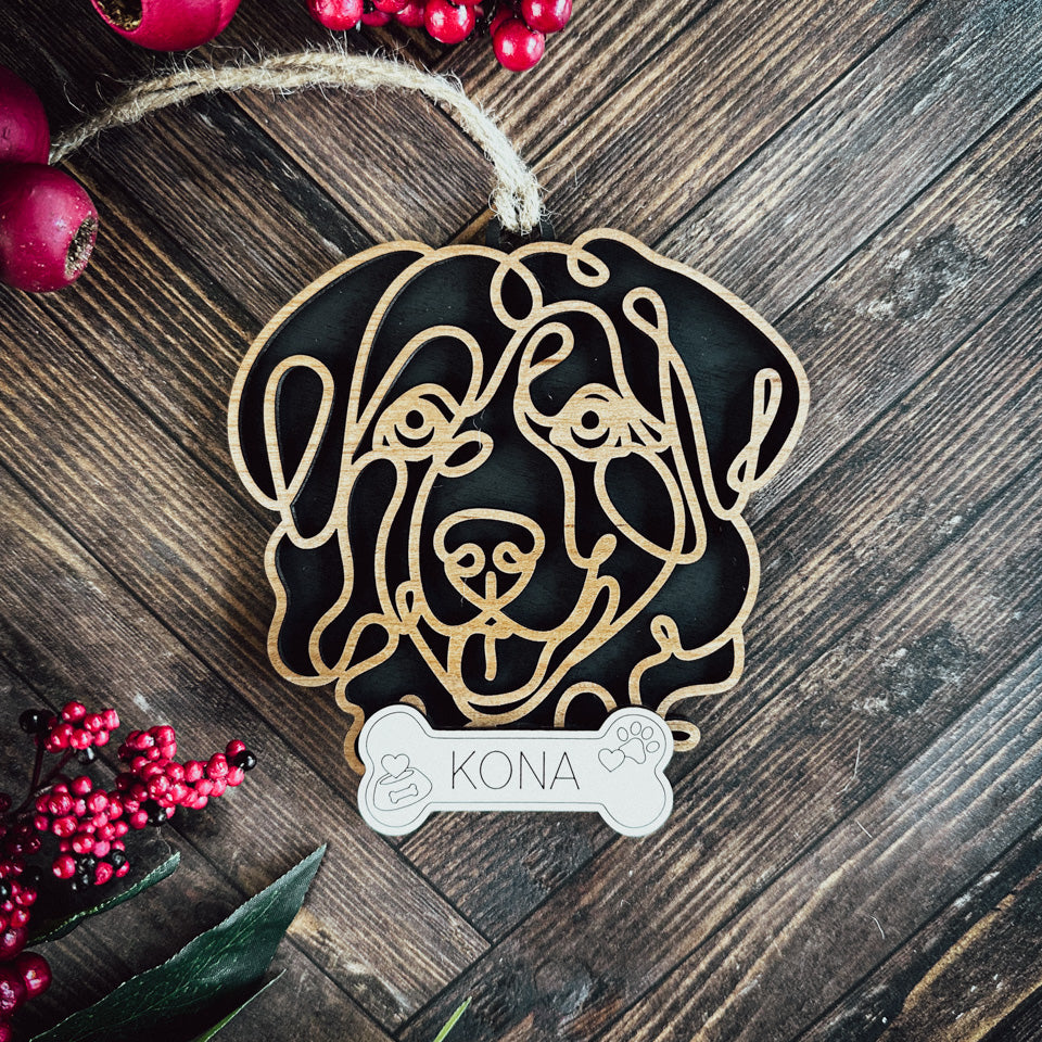 Grat Pyreneese line art dog ornament laser cut from natural wood.