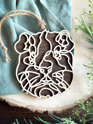 guinea pig line art ornament laser cut from natural wood in continuous line style