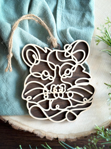 hamster line art ornament laser cut from natural wood in continuous line style