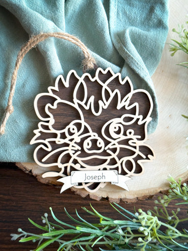 hedgehog line art ornament laser cut from natural wood in continuous line style