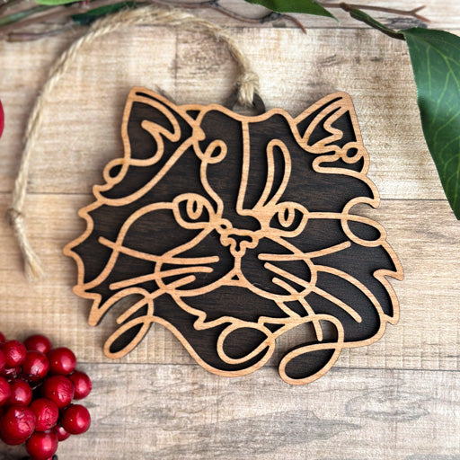 Himalayan line art cat ornament laser cut from natural wood, minimalist feline silhouette design