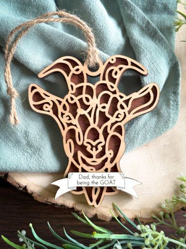 goat line art ornament without horns laser cut from natural wood in continuous line style