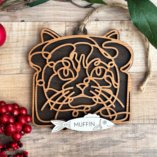 InBread Cat line art cat ornament laser cut from natural wood, minimalist feline silhouette design
