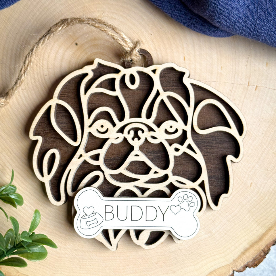 Japanese Chin line art dog ornament laser cut from natural wood.
