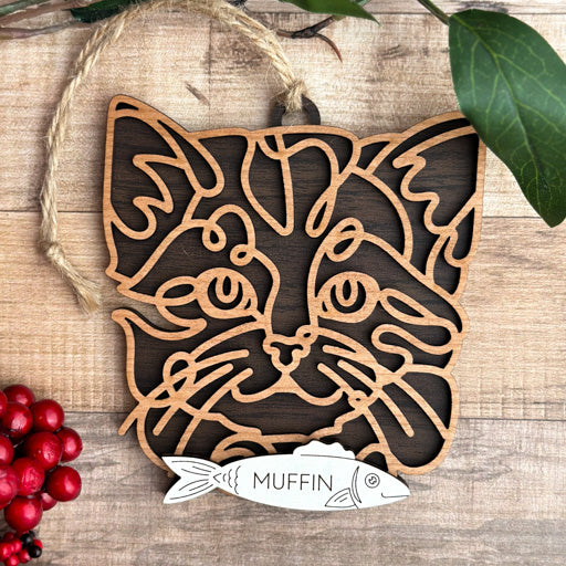 Kitten line art cat ornament laser cut from natural wood, minimalist feline silhouette design