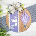 Decorative sign with lavender design and 'Hello' text on a wooden background