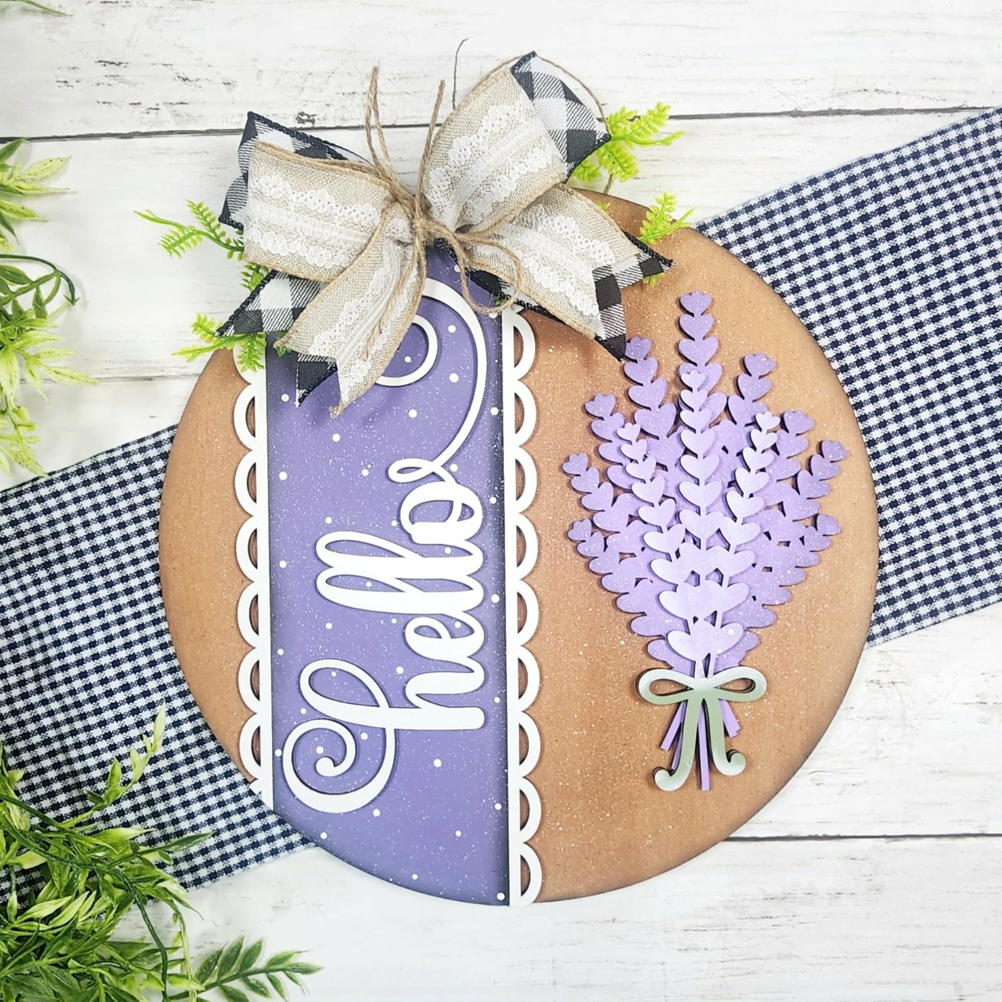 Decorative sign with lavender design and 'Hello' text on a wooden background