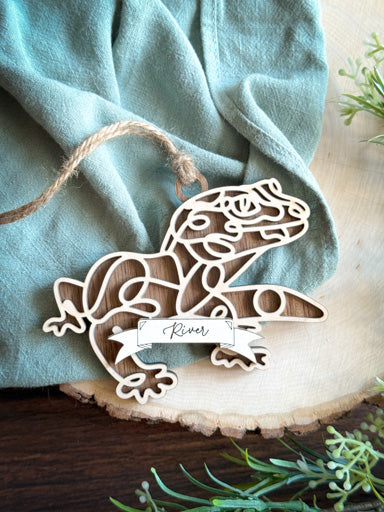 leopard gecko line art ornament laser cut from natural wood in continuous line style