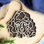 Miniature Poodle line art dog ornament laser cut from natural wood.